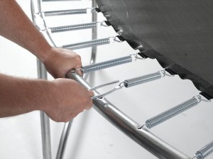 Installing a trampoline spring