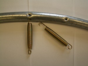 Spring used for frame with round hole (note elongated hook end)